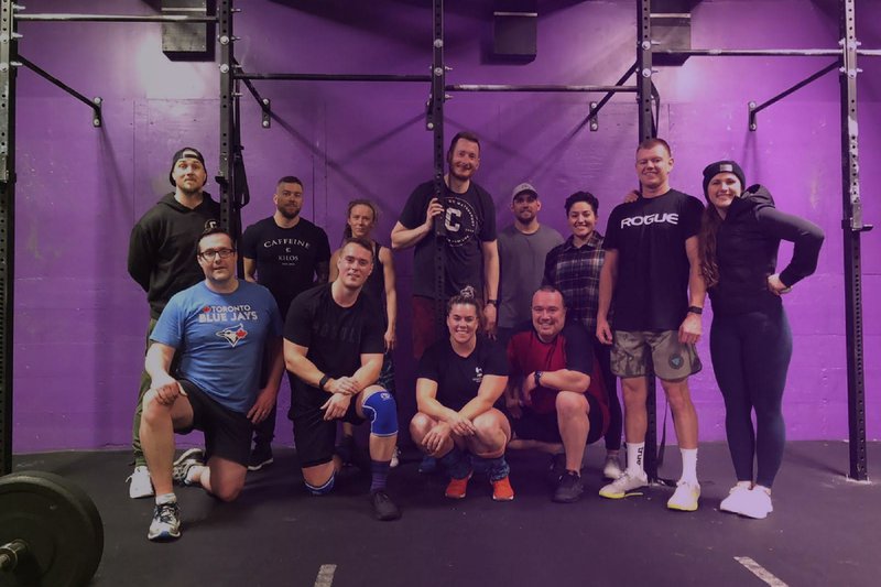 Purple branding on gym walls